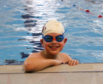 Smiling boy in swimming pool